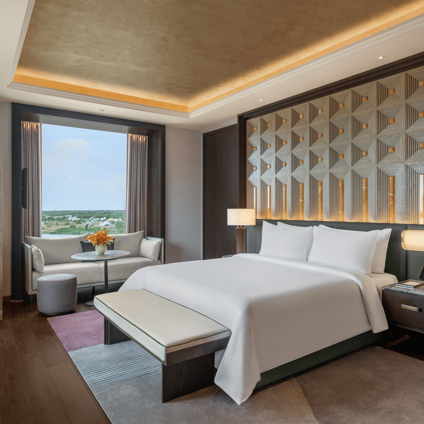 Presidential Suite Room 8001 Bedroom 2 with a bed and window garden view at The Residency Signature Madurai.