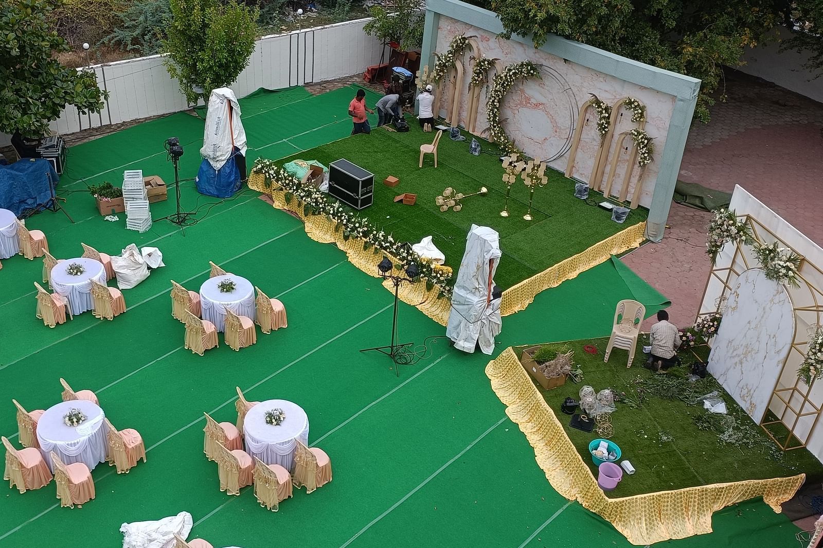 An aerial shot of Starlight Garden, our thoothukudi marriage hall, featuring round tables with chairs placed around them - Regency Tuticorin by GRT Hotels