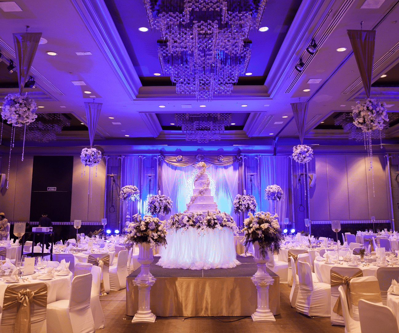 round table seating and chandeliers on the roof of the Banquet Hall at Rhythm Gurugram