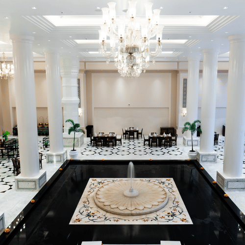 Opulent hotel lobby showcasing marble columns and elegant seating arrangements at Clarks Avadh, Lucknow - The Best Buffet Restaurant in Lucknow