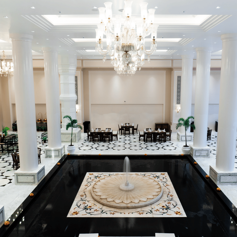 Opulent hotel lobby showcasing marble columns and elegant seating arrangements at Clarks Avadh, Lucknow - The Best Buffet Restaurant in Lucknow
