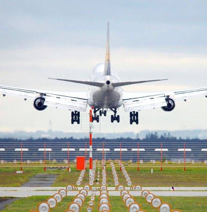 a plane landing on a runway