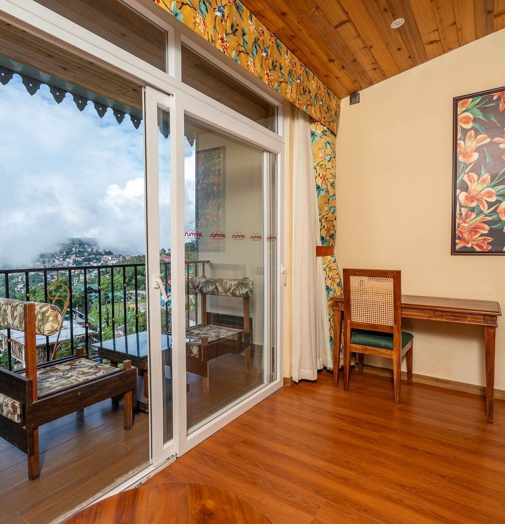 View of the mountains from a balcony of a room at Summit Barsana Resort & Spa, Kalimpong