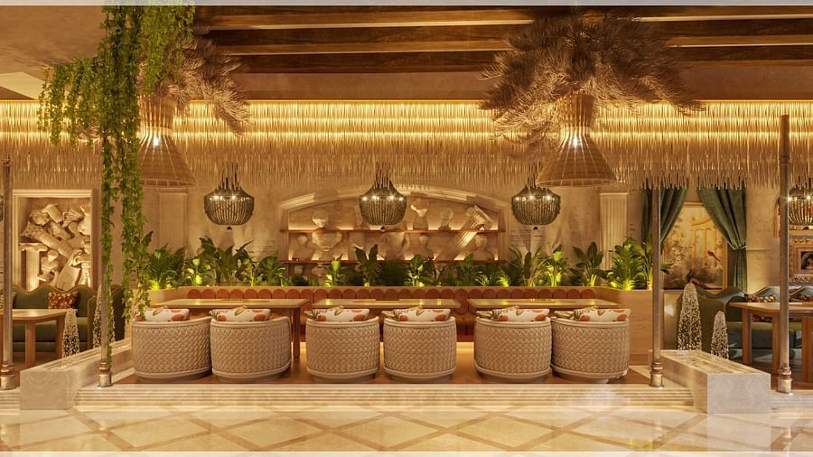 A posh dining venue with an elaborate golden chandelier and a vibrant greenery backdrop at Themis Barbecue House, Ambience Mall, Gurugram