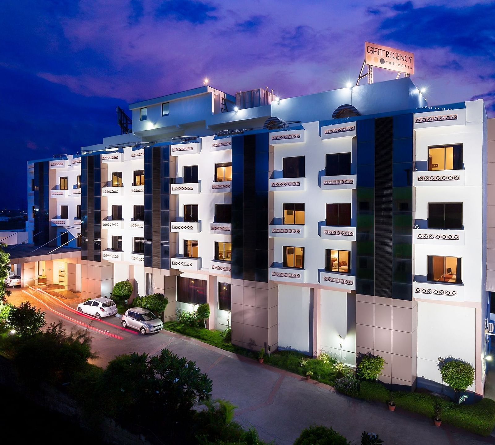 The exterior facade of a hotel building illuminated by warm lights - Regency Tuticorin by GRT Hotels, Best Hotel in Tuticorin