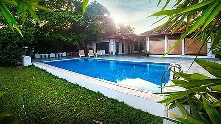 A swimming pool at Heritage Methanam