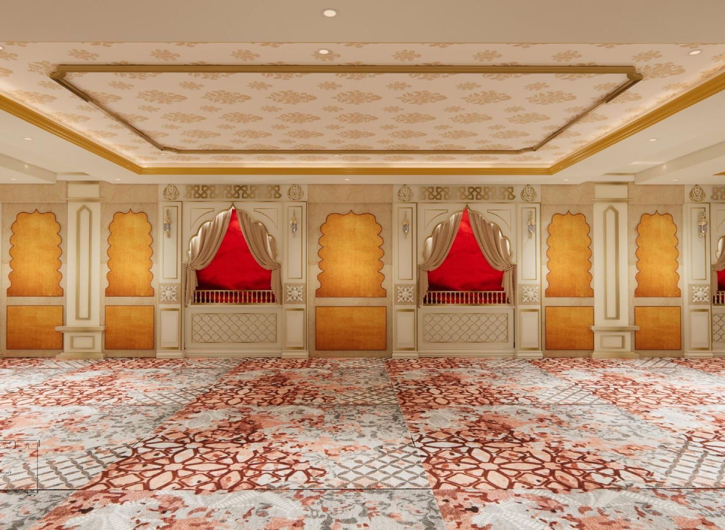 Elegant event space with floral ceilings, majestic pillars, soft lighting, and walls echoing traditional Indian architecture