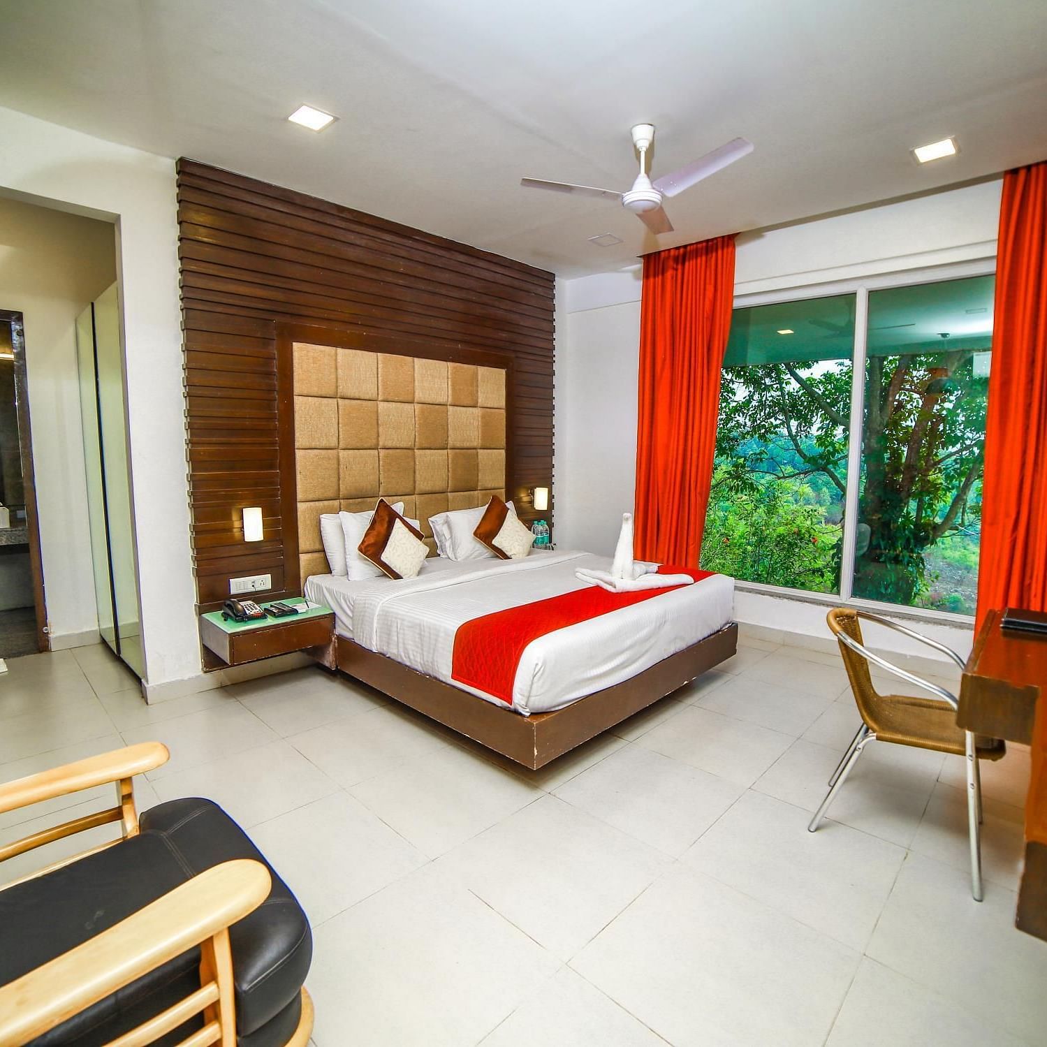 Wide view of the bed in the Artist Suite at Grand Palace, Yercaud