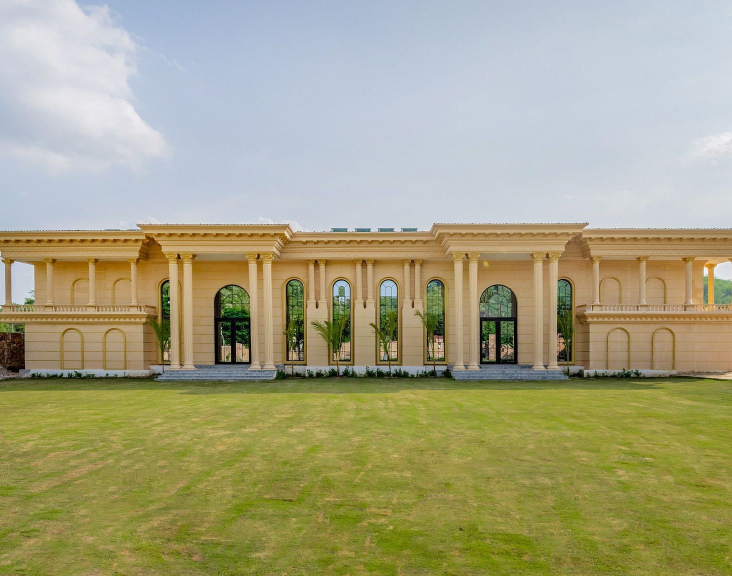 Facade of The Royal Know Banquet Hall at Valley by Grassfield, featuring large windows and a spacious open area in front.