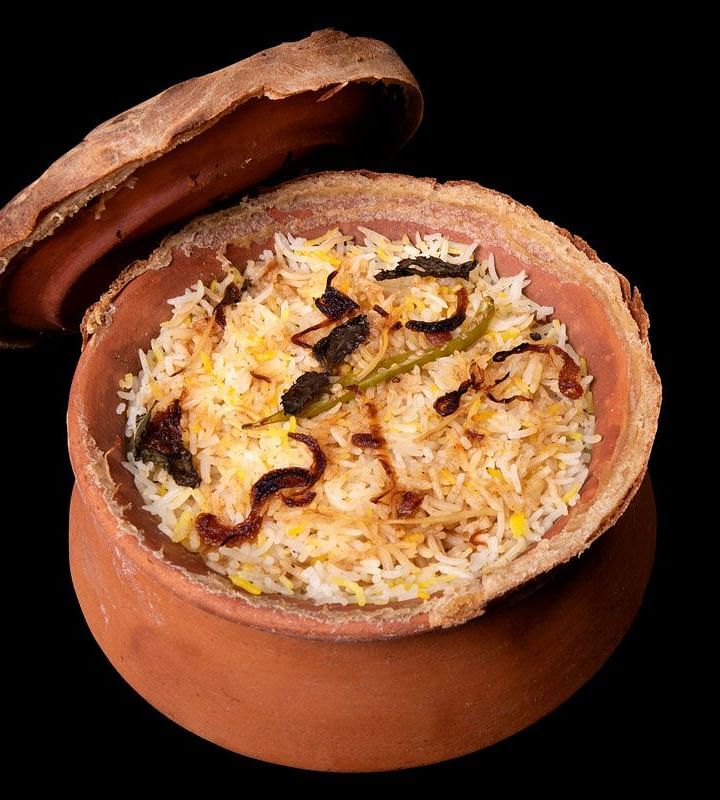image of a earthen pot with veg biryani 
