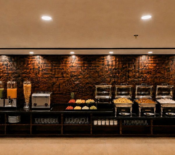 A wide view of the complete long buffet counter line arranged inside the dining area at Lime Tree Hotel & Banquet, Jaipur.