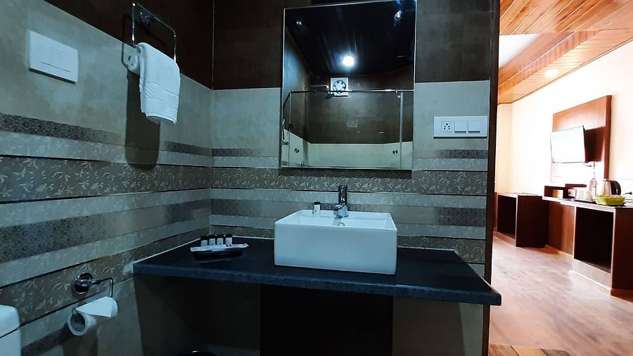 Medium shot of bathroom in family suite in Mastiff Hotel in Manali