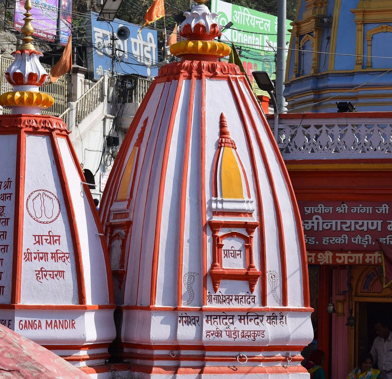 A beautiful Hindu temple complex, with intricate carvings and colorful decorations.