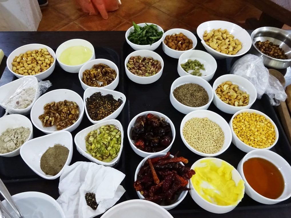 Multiple bowls filled with a variety of ingredients used for cooking.