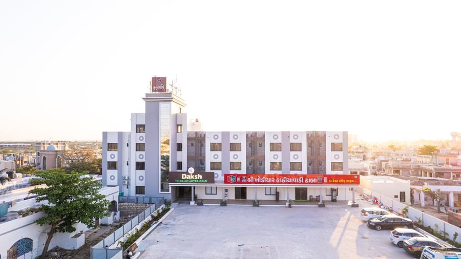 Expansive aerial view of Daksh The Grand Gowardhan, Dwarka, under bright sunlight, highlighting its layout and spacious grounds.