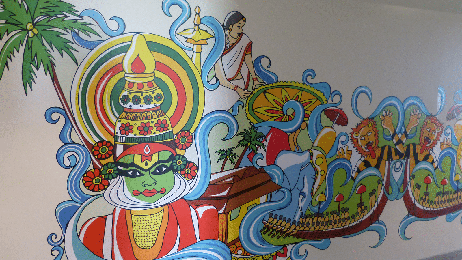 Kerala-style dance and makeup are depicted in paintings on the walls