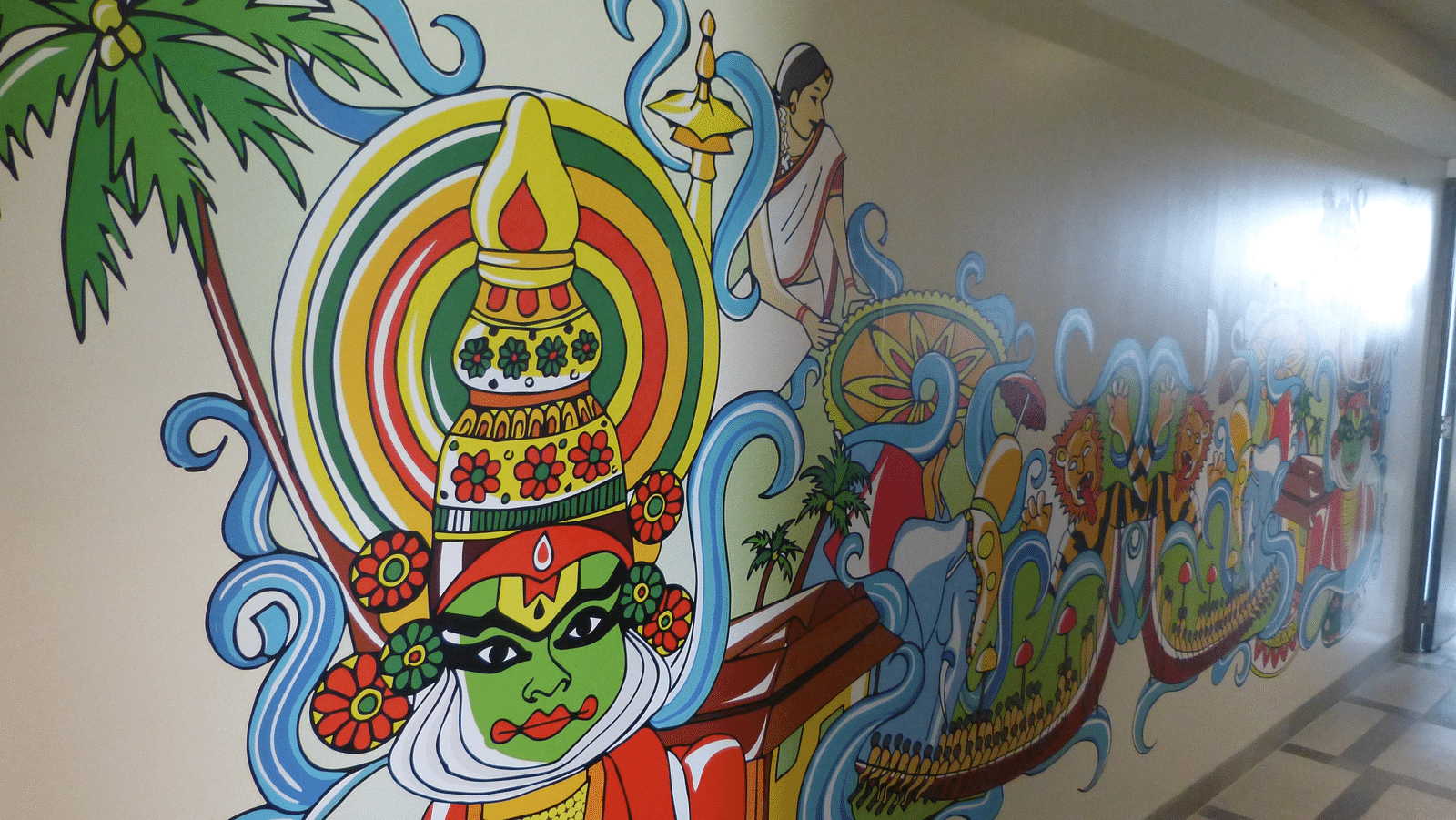 Kerala-style dance and makeup are depicted in paintings on the walls