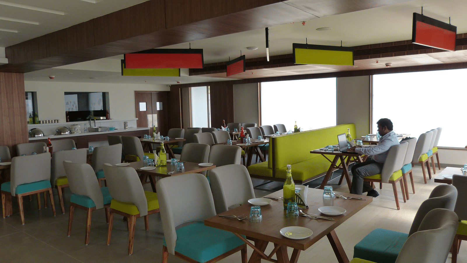 The dining area has chairs and tables arranged neatly for the guests