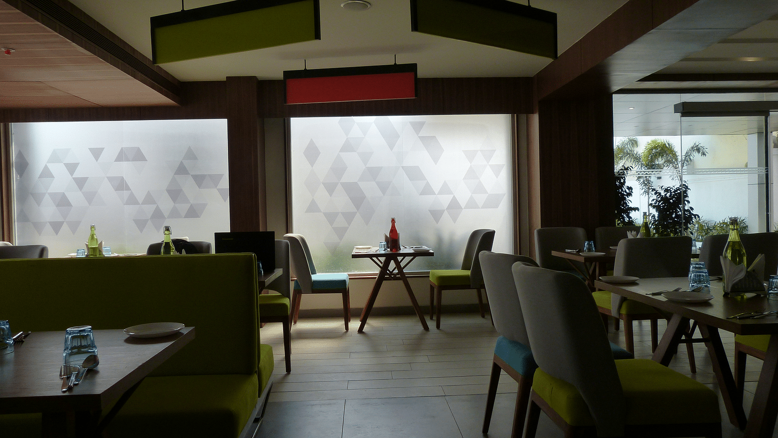 The dining area has chairs and tables arranged neatly for the guests