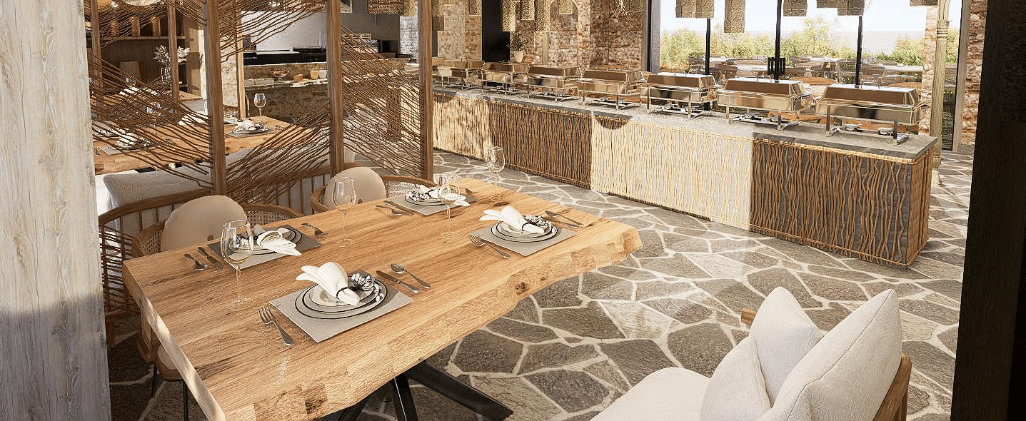 Diagonal view of the restaurant with neatly set tables and chairs, featuring a central table with a buffet setup at The Evren, Vagator.