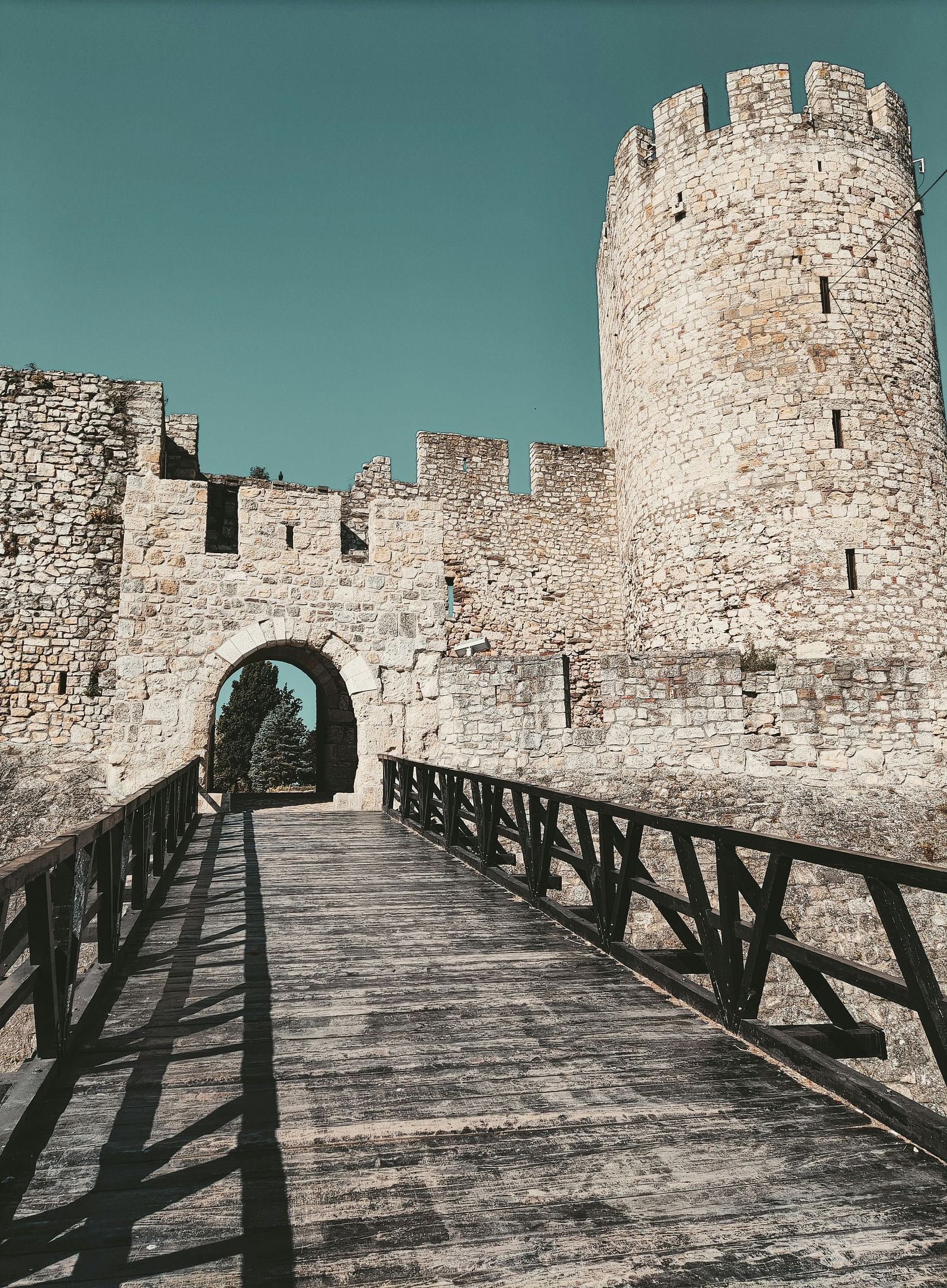 An overview of the entrance to a fort with a stone structure of the fort in view