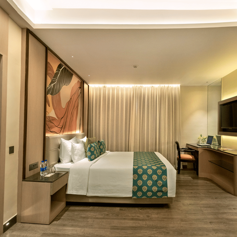 Well designed guest room with king bed, work desk and soft ambient lighting at The Sonnet, Jamshedpur.