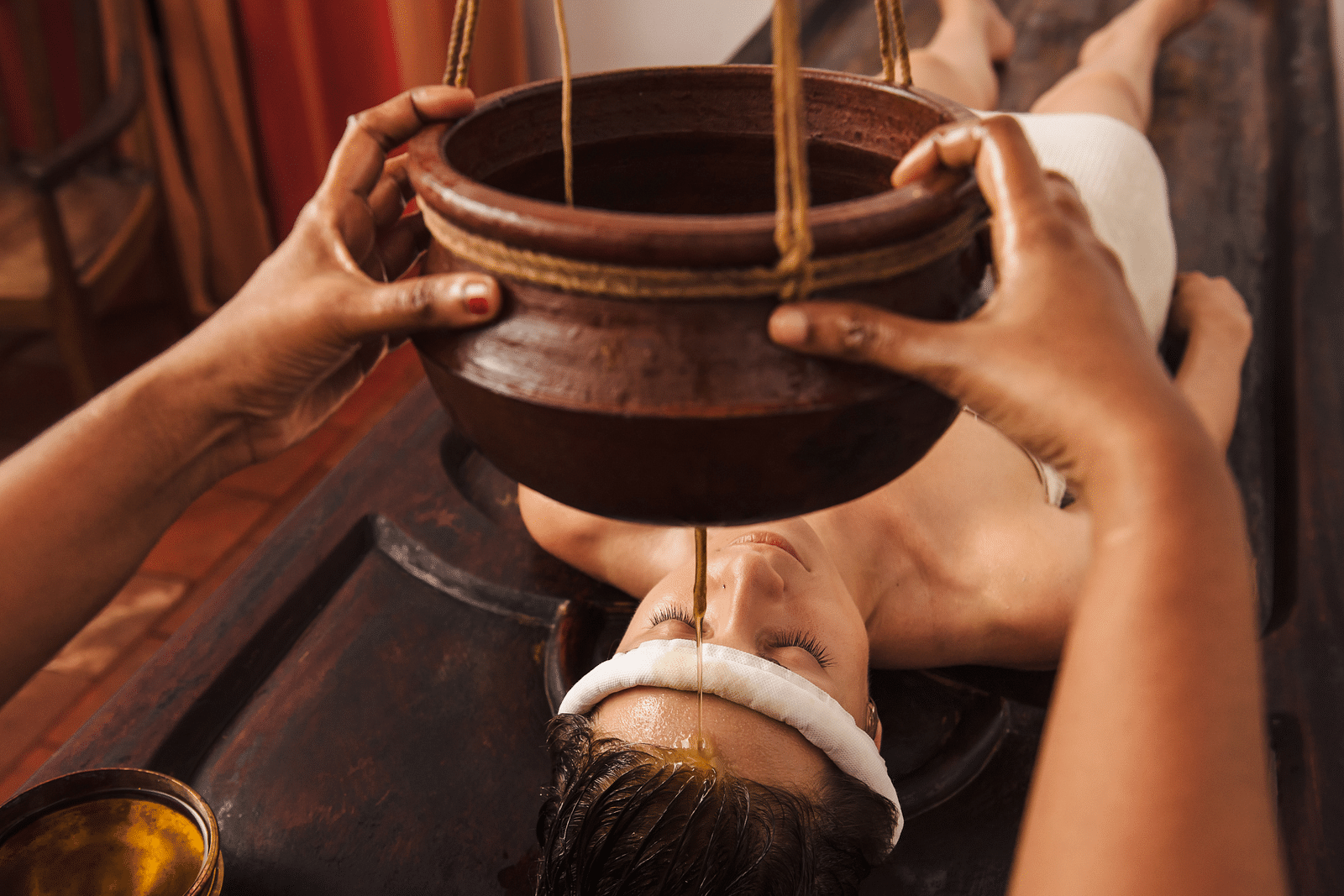 an image of Shirodhara treatment - Kerala Ayurveda - Rhythm Kumarakom