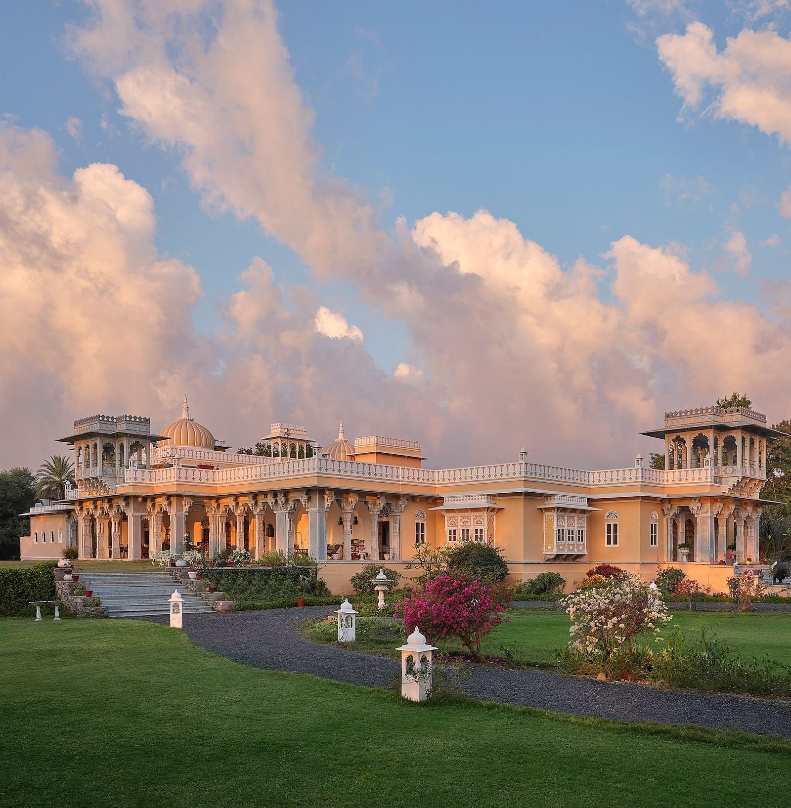 facade image of dev shree, deogarh with a picturesque sky with clouds in the background