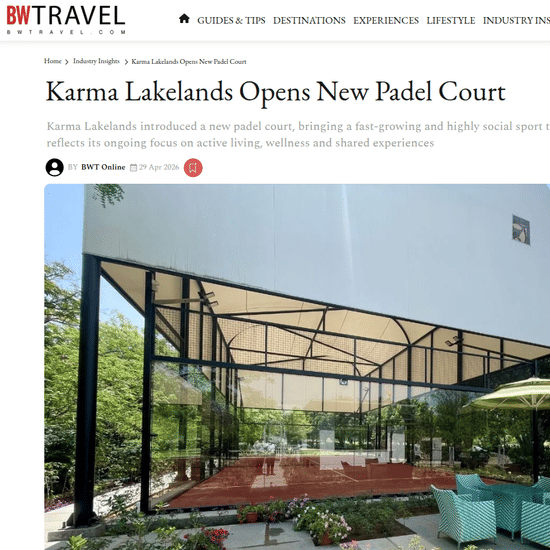 A digital press release from BW Travel titled 'Karma Lakelands Opens New Padel Court.' The article features a wide-angle photograph of a new, professional outdoor padel court with a modern canopy structure, surrounded by trees.