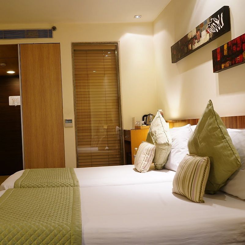 Standard Room furnished with a plush bed at Shervani Nehru Place, New Delhi
