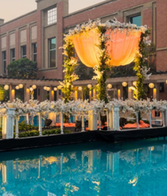 View of seating arrangement besides the swimming pool at Nirvana Luxury Hotel, Ludhiana