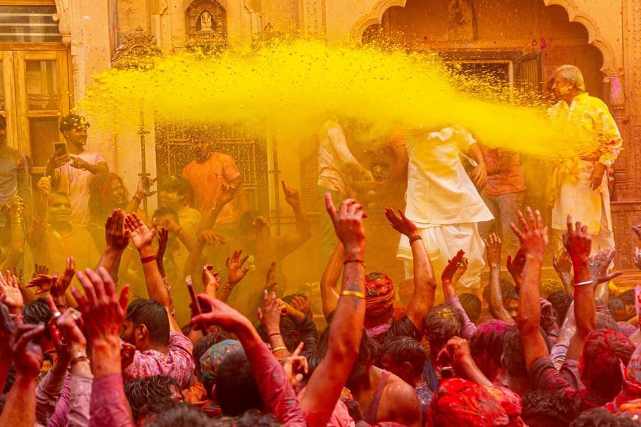 People immersed with several colours during holi festival.