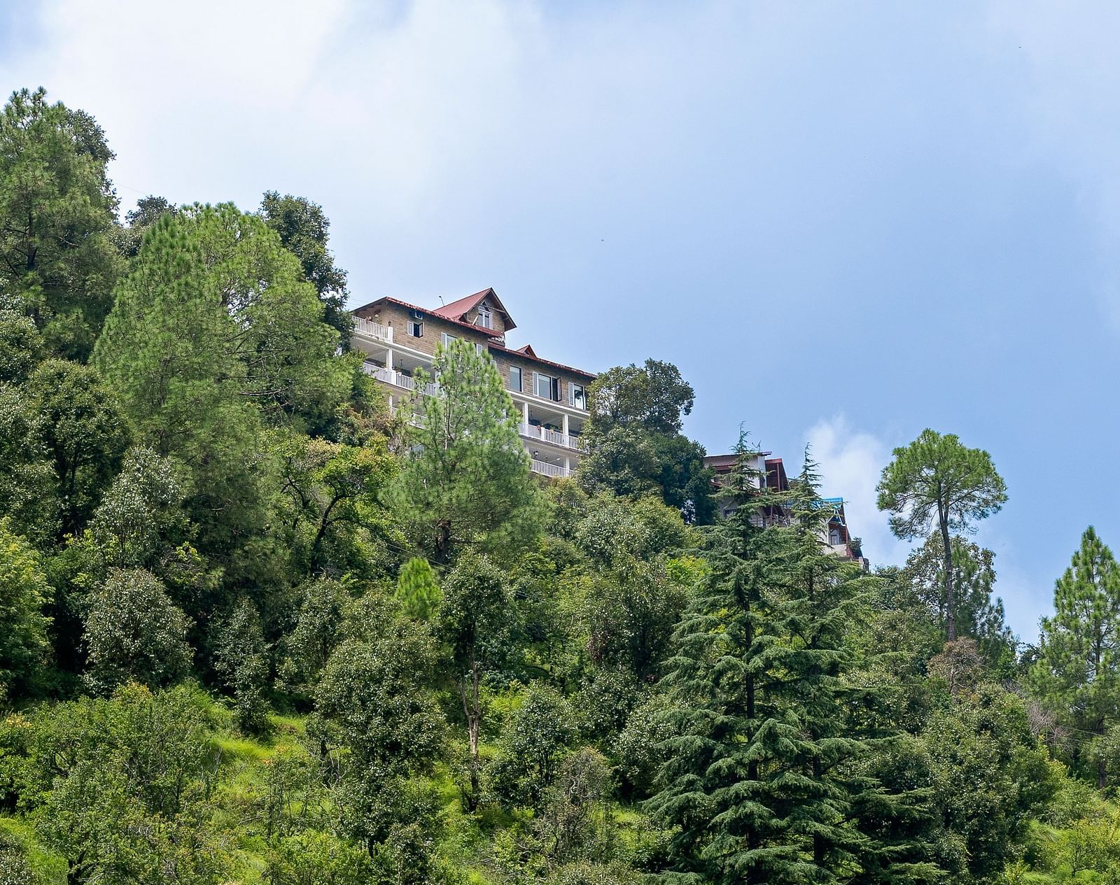 Scenic view of BluSalzz Collection - Suvaasa Resort, Ramgarh nestled on a lush hillside