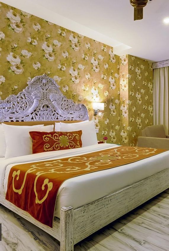 Image of a room wuth bed ans sitting area at Summit By The Ganges Beach Resort & Spa, Rishikesh
