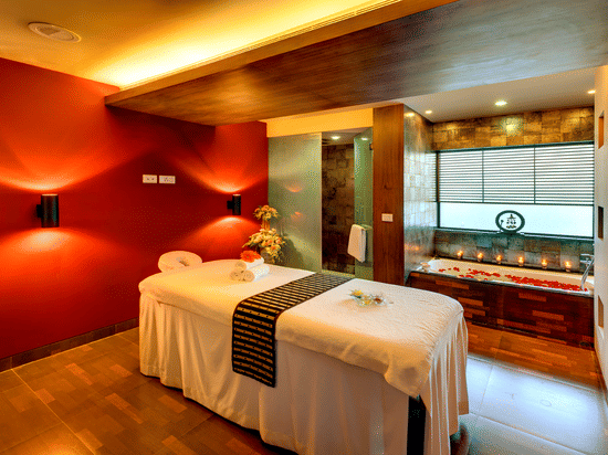 Massage room with a massage table at spa in Kolkata (Park Street) at Kenilworth Hotel