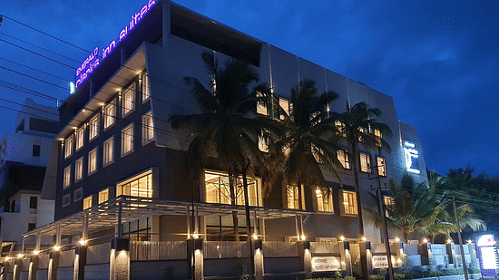 Hotel exterior in night sky with warm lighting around