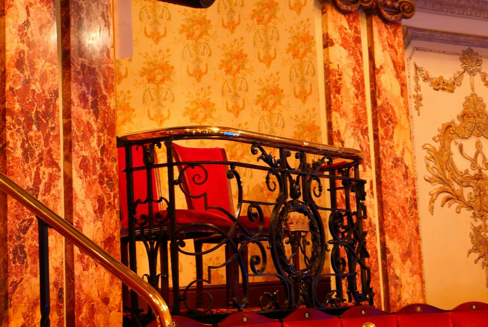 an image of a theatre with chairs and a screen behind it.