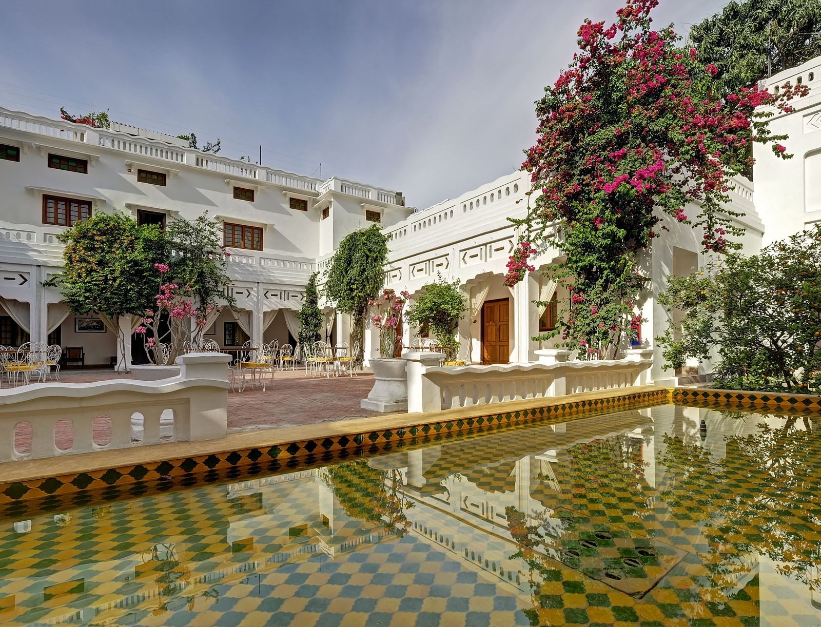 An overview of the hall Sehen with a waterbody in view - Saraca Hotel Lucknow.