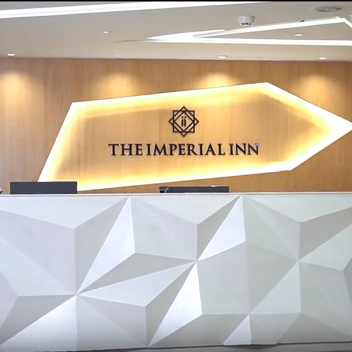 Image of a reception of Yashree Imperial inn with the name of hotel written on wall