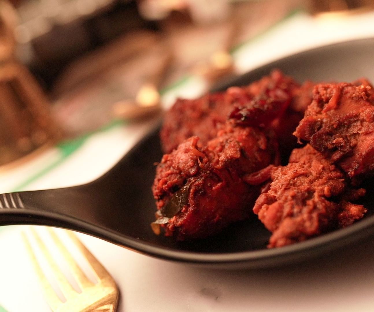 An image of chicken fry served in a small pan - Pai Group of Hotels