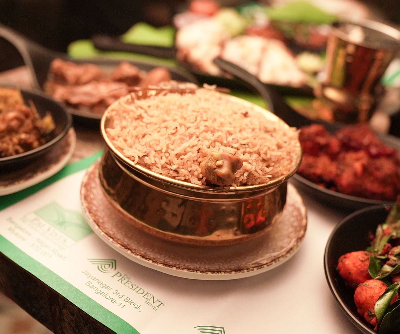 An image of chicken biryani with chiecken gravy and fry - Pai Group of Hotels