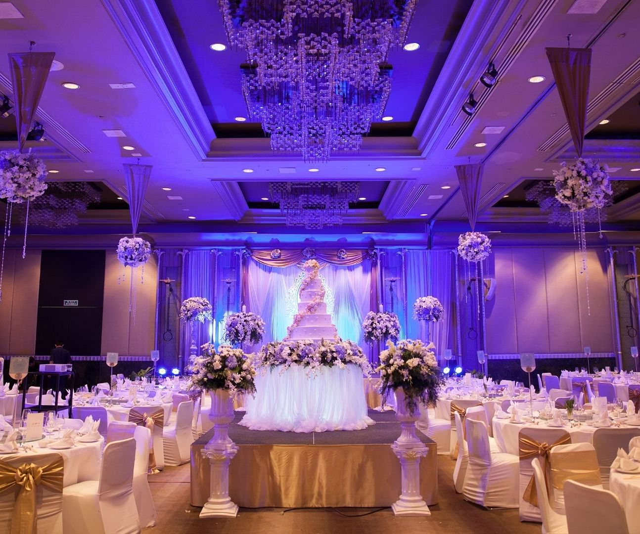 round table seating and chandeliers on the roof of the Banquet Hall at Rhythm Gurugram