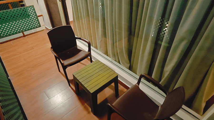 A private balcony area at Smith Balcony Villa with a small table and comfortable seating