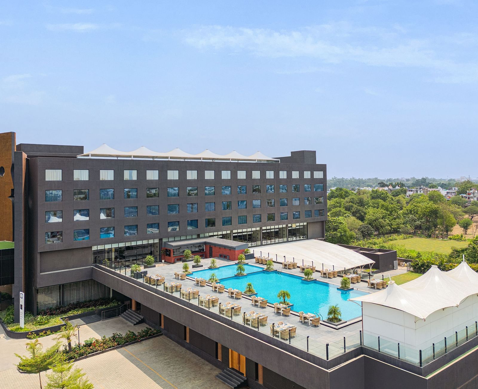 Exterior with the swimming pool in view of Essentia Luxury Hotel, Indore during the day