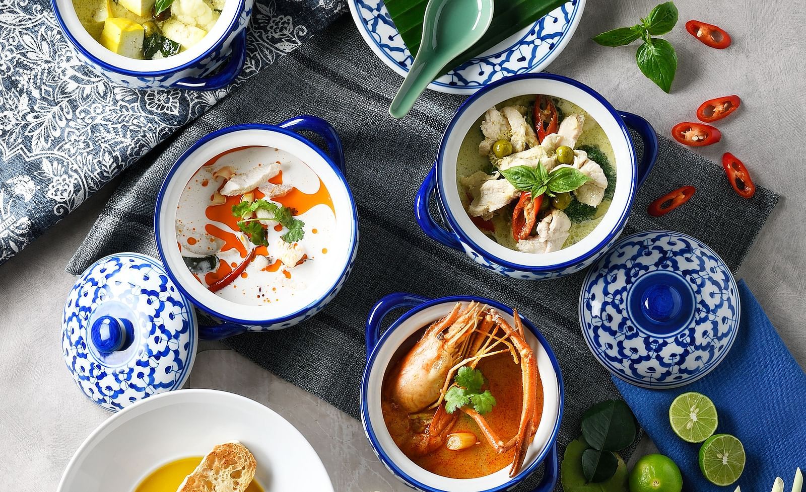 Bowls of Thai soup on a table