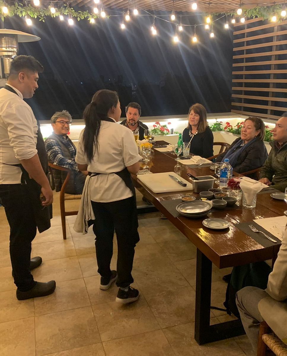 A group of people gathered for the chefs table dinner