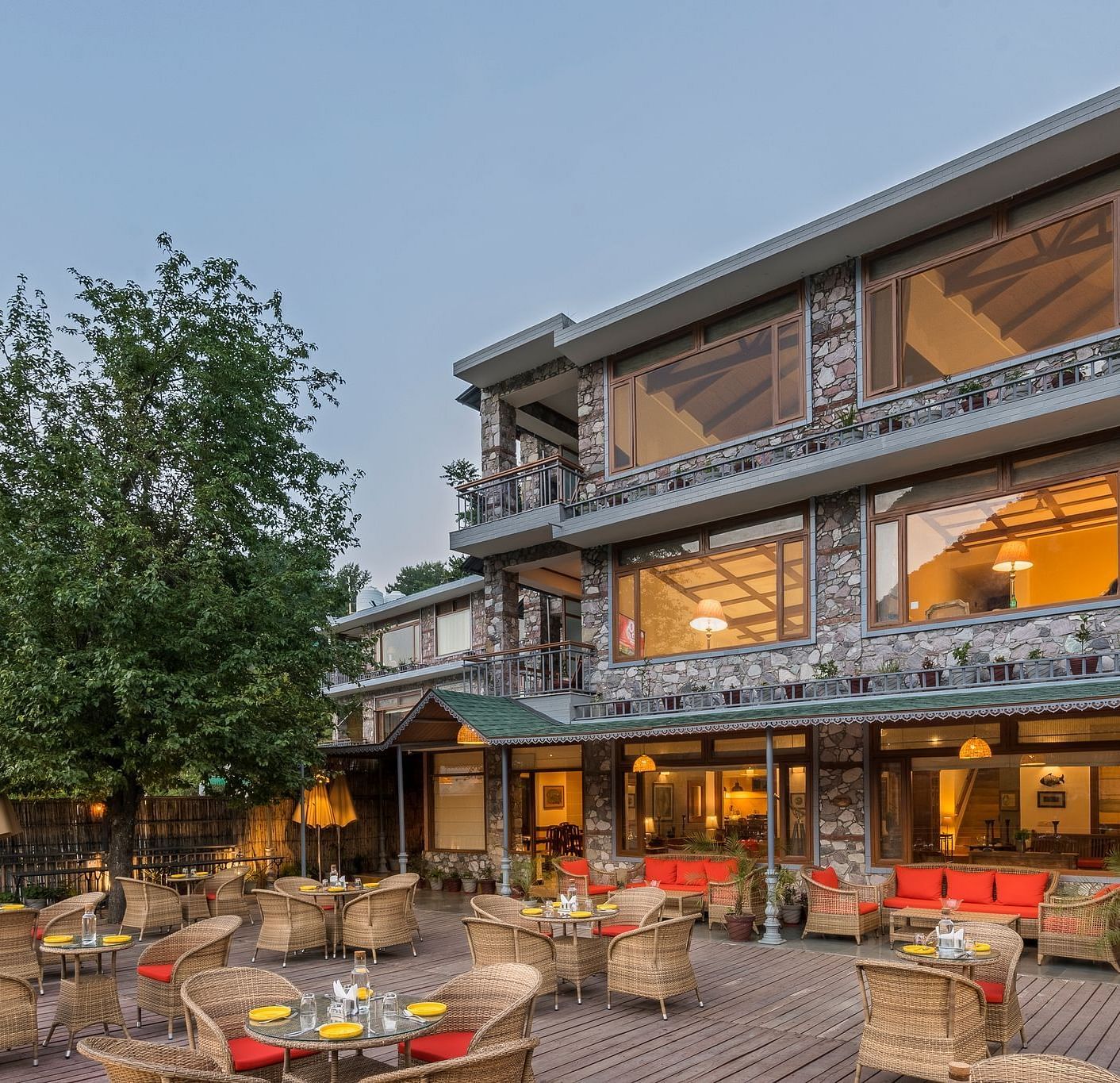 Outdoor restaurant at Fishermen's Lodge, Bhimtal, featuring a beautiful view, creating a perfect setting for dining in nature.