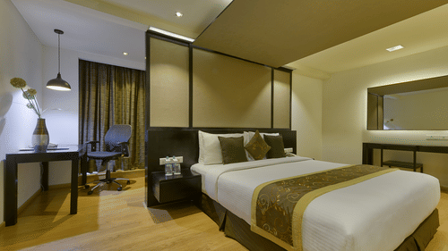 DELUXE SUITE BED ROOM at Davanam Sarovar Portico Suites Bangalore