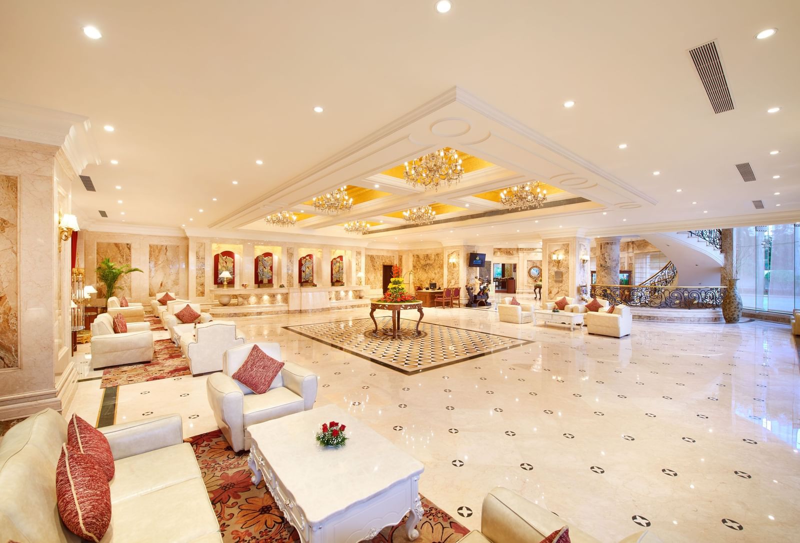 An image of a lobby featuring multiple seating areas and table placed at the centre of the lobby at Accord Metropolitan