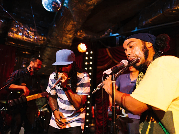 Musicians performing live on stage under colourful lights - S Hotel Montego Bay, Jamaica